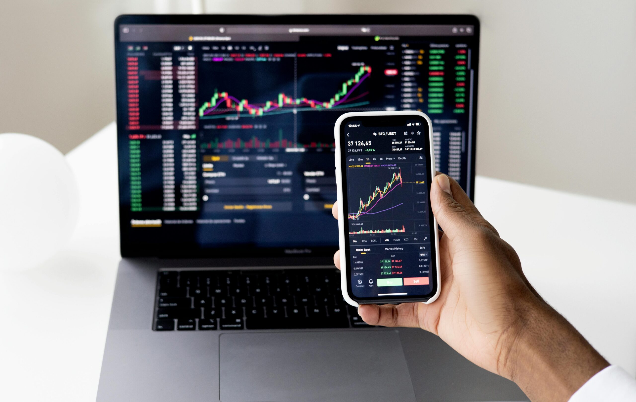 image of a phone and a computer screen with data on it